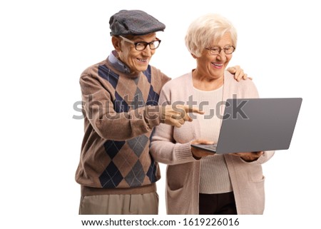 Elderly man and woman looking at a laptop computer isolated on white background
