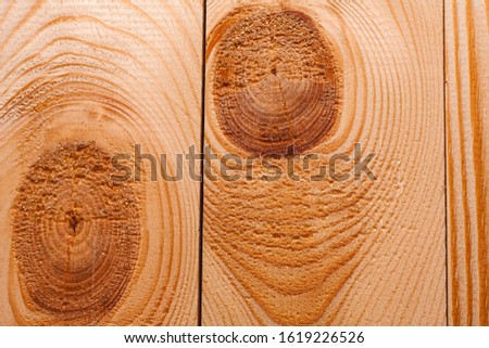 Pine boards close-up with knots. Stock photo wooden background texture.