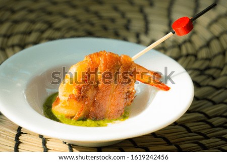 Appetizer Bacon wrapped Shrimp wrapped in Pesto sauce 