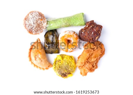 A picture of famous Nusantara dessert or bitesized snack called "kuih" on white background. It is famous streets food in Malaysia and Indonesia.
