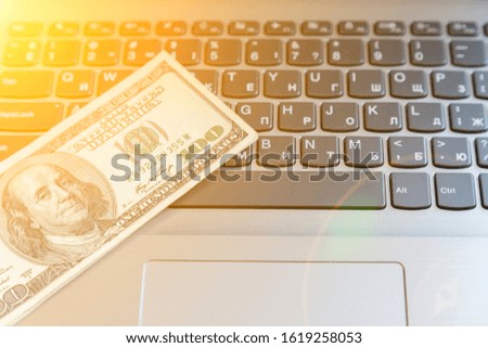 Freelance Concept. Laptop and Dollars. Money and Computer Keyboard. US Currency and Notebook. Business and Finance Template. toned