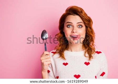 Close-up portrait of her she nice attractive lovely funky comic cheerful cheery wavy-haired girl licking lip want wish tasty yummy delicious festal meal isolated on pink pastel color background Royalty-Free Stock Photo #1619289049