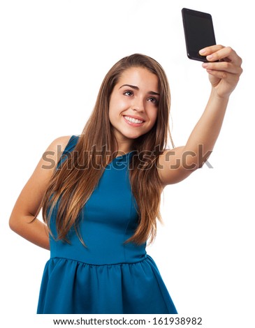 young woman taking a photo of her-self on white background