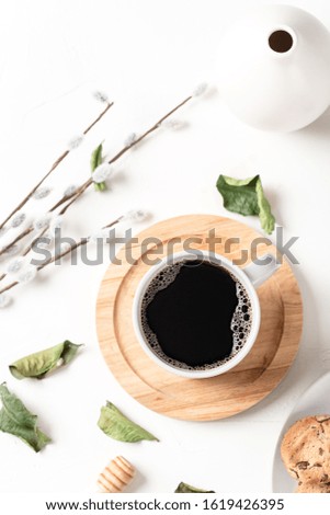Black coffee composition on white background with texture. Coffee in beige cups. Breakfast concept
