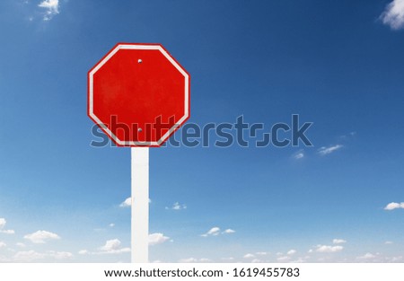 empty traffic red stop sign on blue sky and cloud.