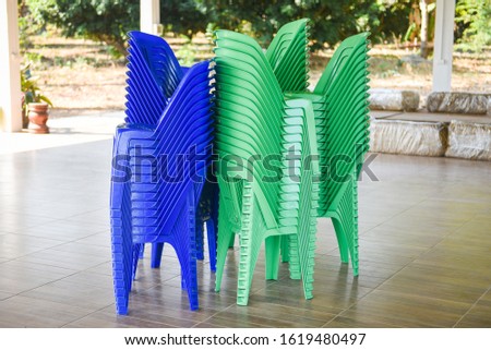Green and blue chair storage on stack / Plastic chair