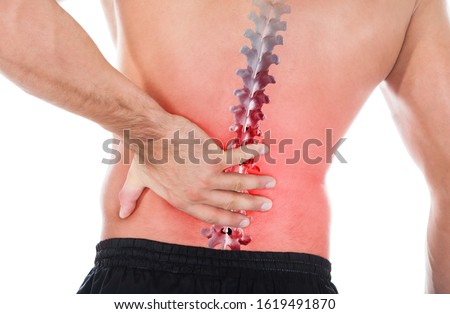 Young Man With Pain In His Back