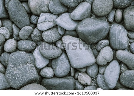 Pebbles stone background with vintage filter 