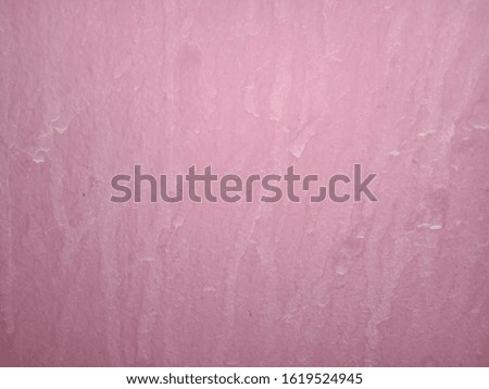 Pink concrete floor with stains