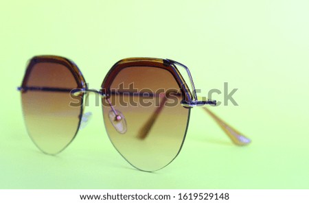 Top view of beach summer accessories with copy space. Lay flat holiday fashion background on color background. Horizontal frame for tour operator or wellness concept.