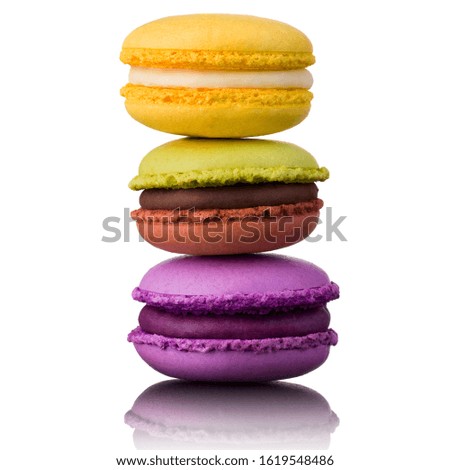 Stack of french colorful macaroons on table isolated on white background with clipping path.