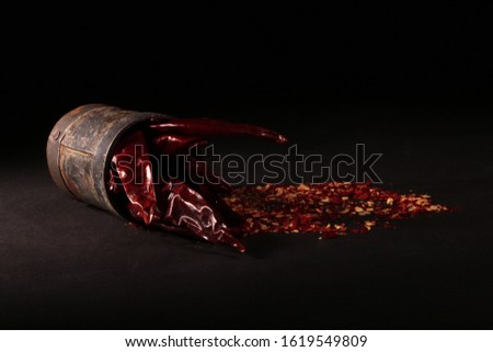 Stock Photography of Dry Hot Red Chilli and Grinded Chilli Powder.