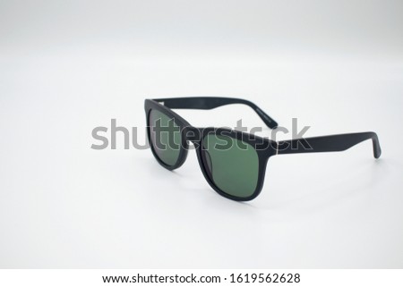 Black sun glasses isolated in white background Royalty-Free Stock Photo #1619562628