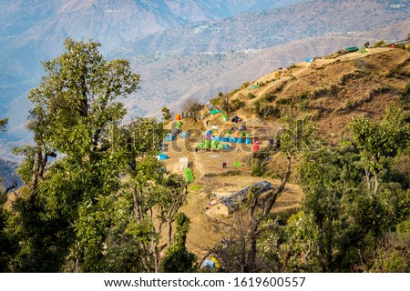 Aerial view of the camps on Nag Tibba trek located in Dehradun Uttarakhand India. Natural beauty in Uttarakhand. Mountains view of Nag Tibba Trek with base camp starting from Pantwari Village. - Image