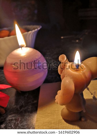 Festive candles and tangerines on the table