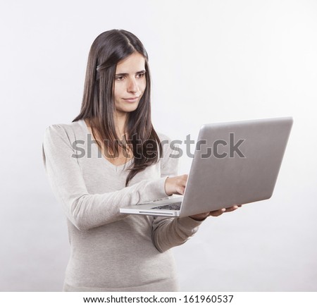 beautiful young woman using a laptop computer