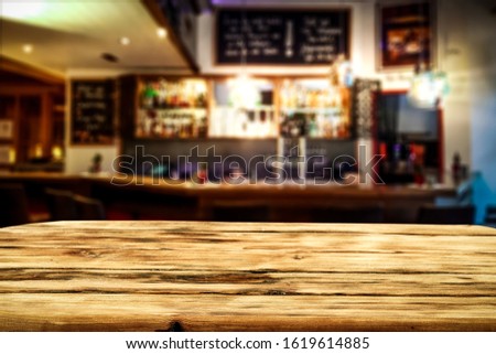 Table background of free space and blurred bar 