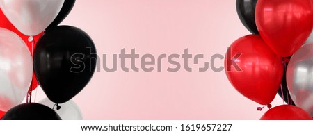 colorful balloons on pink background