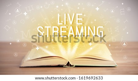 Open book with LIVE STREAMING inscription, social media concept