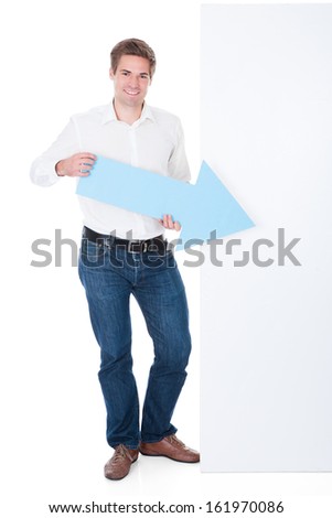 Happy Young Man Holding Blank Placard Over White Background