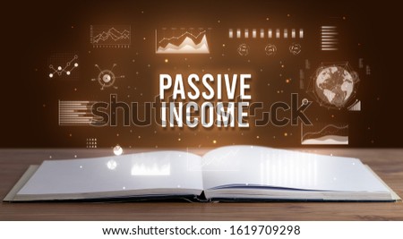 PASSIVE INCOME inscription coming out from an open book, creative business concept