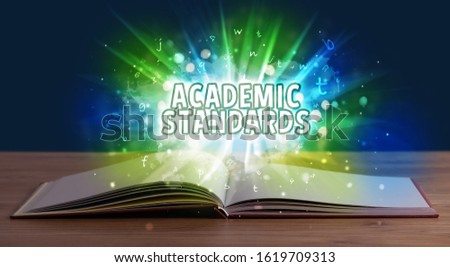 ACADEMIC STANDARDS inscription coming out from an open book, educational concept