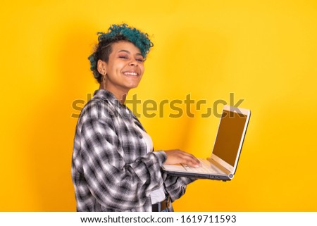 woman or girl with laptop computer isolated on color background