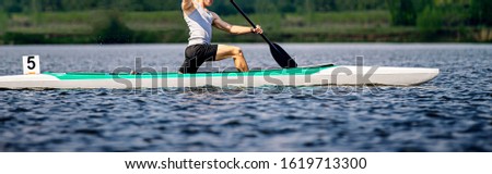 athlete canoeist rowing in canoe, competition race