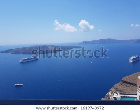 Pictures taken in Santorini Greece on the Caldera overlooking the remnants of the dormant volcano. Beautiful blue sea and clear blue sky views.