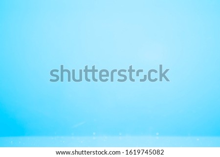 A blue underwater background with a gradation from the center in a circle