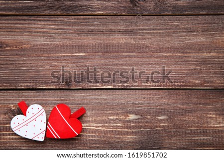 Valentine hearts on brown wooden table