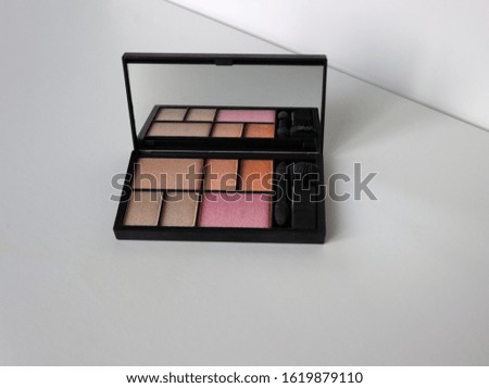 Make up products isolated on white background. Beauty items. Eyeshadow.