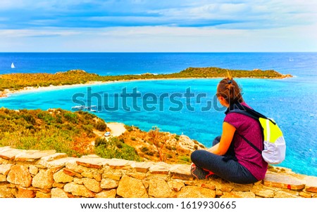 Woman and Landscape of Capo Coda Cavallo seen from San Teodoro in the Mediterranean sea in Olbia-Tempio province, Sardinia island, Italy in summer. Girl and Scenery at Tavolara Island. Mixed media.