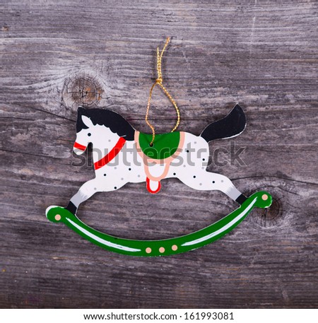 Christmas decorative ornament - Horse ornament on wooden background