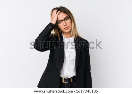 Young business caucasian woman tired and very sleepy keeping hand on head.
