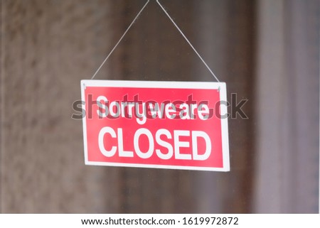 Sorry we are closed sign in shop window door due to Coronavirus