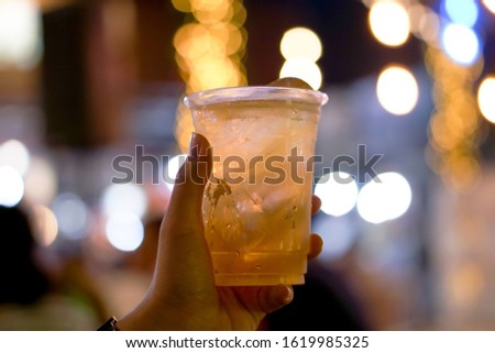 Catch a beer glass And vibrant color bokeh