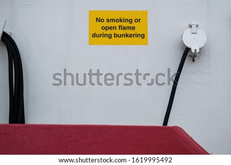 No smoking or open flame during bunkering. A sign on a industrial tug boat, used in the oil industry. In Bergen, Norway. 