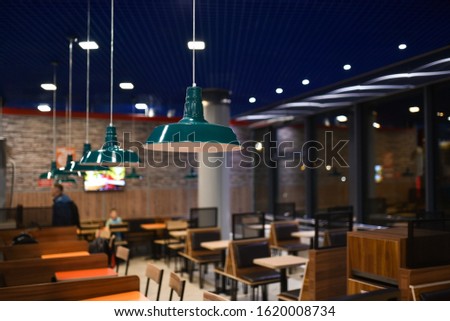 Evening interior of fast food cafe. Royalty-Free Stock Photo #1620008734
