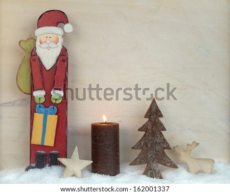 Background with a candle and santa claus