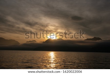 Sunrise over the mountains near the ocean in Alaska