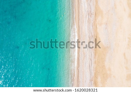 Aerial view of turquoise sea waves and sandy beach, Turkey, Antalya.