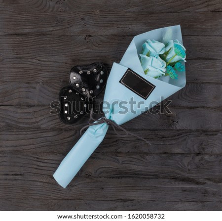 blue bouquet for valentines day on a black wooden table