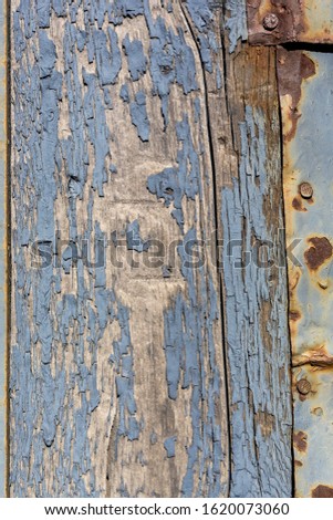 Wood texture with peeling blue paint