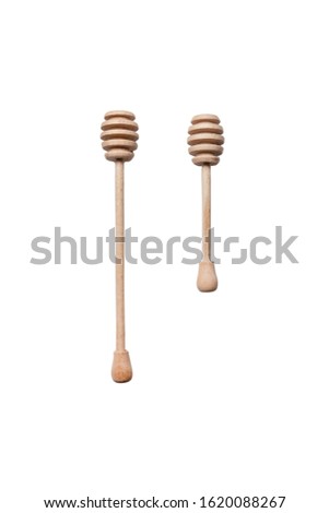 Wooden honey sticks on a white background