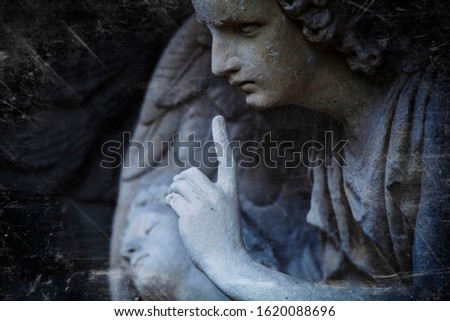 Retro styled an ancient statue of an angel as symbol of end of life. Horizontal image.