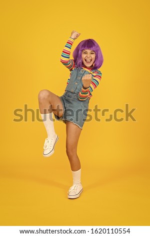 Cosplay character concept. Culture hobby and entertainment. Cosplay outfit. Otaku girl in wig smiling on yellow background. Happy childhood. Anime fan. Cosplay kids party. Child cute cosplayer.