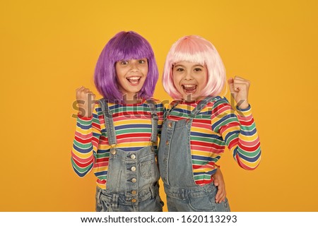 Anime fan. Animation style characterized colorful graphics vibrant characters fantastical themes. Anime convention. Happy little girls. Cheerful friends in colorful wigs. Anime cosplay party concept.