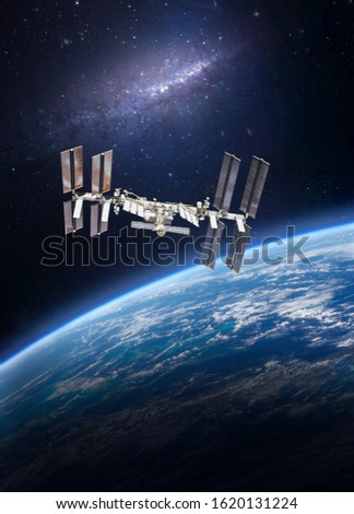 International space station on orbit of Earth planet view from outer space. ISS. Nebula. Vertical wallpaper. Elements of this image furnished by NASA