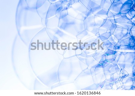 Creative abstract background made of  chain of bubbles structure in dark blue tones